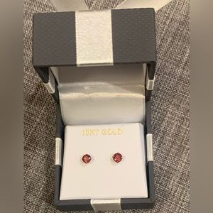 10k YG 4mm authentic garnet, studs. Brand new.